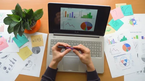 Man nervously struming pen at office surrounded by a lot of paperwork, top view Stock-Footage 87779816