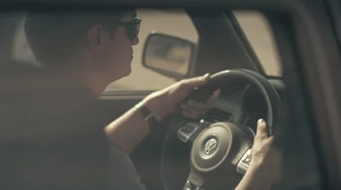 Man nervously wait then driving a sport car Stock Footage 62650079