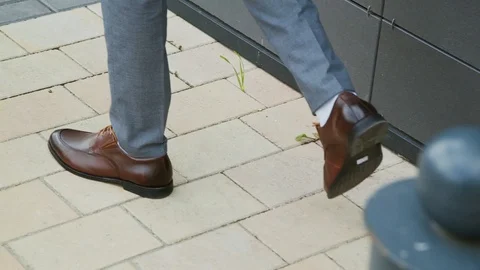 A man in new shoes is walking down the street. Stock Footage 108838845