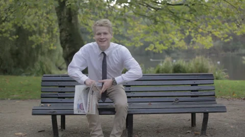 Man With Newspaper In The Park 動画素材 33806369