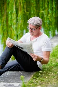 Man with newspaper Stock Photos