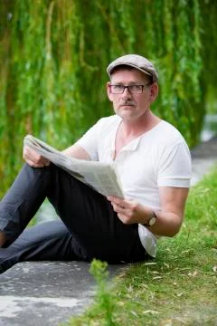 Man with newspaper Stock Photos