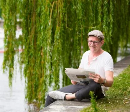 Man with newspaper Stock Photos