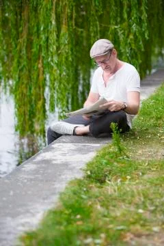 Man with newspaper Stock Photos