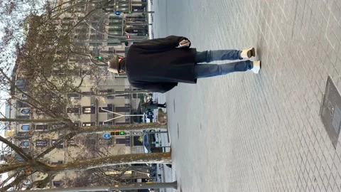 A man with newspaper walking in Barcelona. Vertical video Stock Footage 173234492