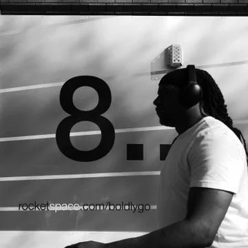 Man Next To Number 8 Stock Photos