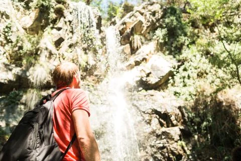 Man next to the waterfall Stock Photos