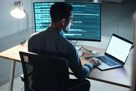 Man, night and coding in office, computer or blank screen for mockup space with Stock Photos