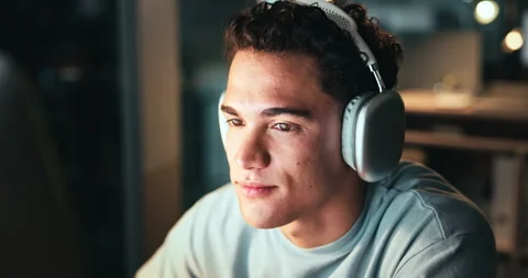 Man, night and headphones for coding on computer in office, software developer Stock Footage 301368540