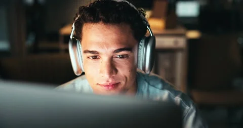 Man, night and headphones for programming on computer in office, software Stock Footage 301368345
