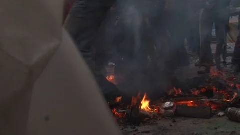 Man in Nike sneakers dancing in the fire at the flour wars festival Stock Footage 87619642