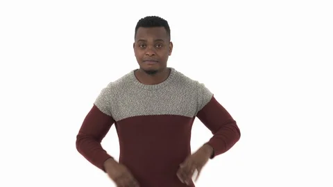 Man nods his head slightly while touching his chin and then looks at the camera. Stock Footage 124200745