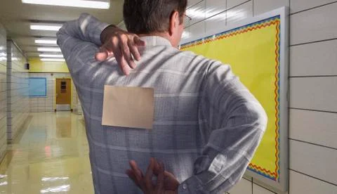 Man with note on back in school hallway Stock Photos