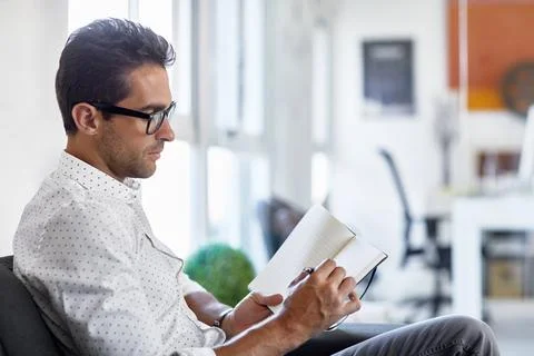 Man, notebook and writing in office with document, schedule or review agend.. Stock Photos