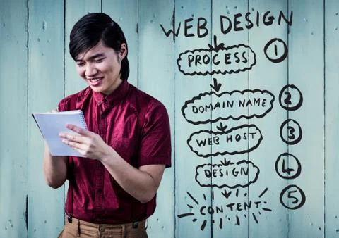 Man with notepad against website mock up and blue wood panel Stock Photos