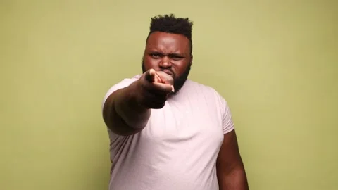Man noticing and pointing finger to camera, accusing with serious bossy face, Stock Footage 220472877