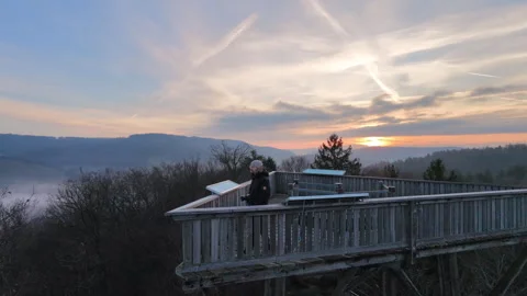 Man on observation tower, Sunrise in background 30FPS Stock-Footage 321632932