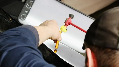 Man observes result of surface leveling process in hall Stock Footage 316178651