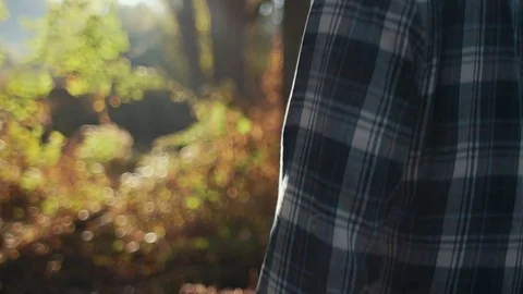 Man Observing Forest During Morning Sunrise (Closeup Steadicam Orbit) Stock Footage 81492015