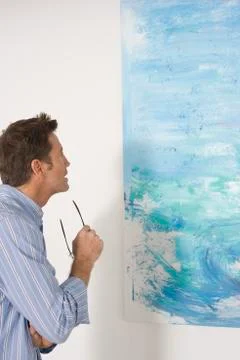 Man Observing Painting In Art Gallery Stock Photos