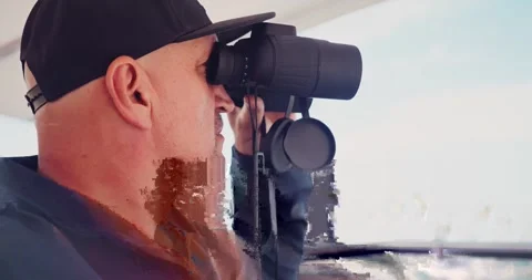 Man Observing Through Binoculars on a Boat 스톡 동영상 323792585