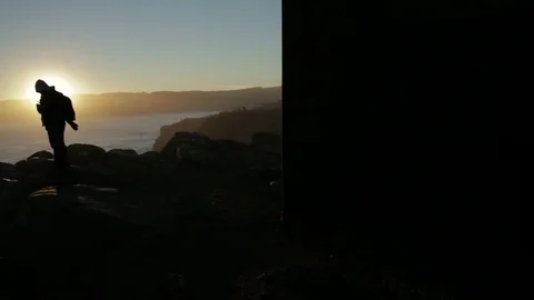 Man at ocean sunset Stock Footage 77048857