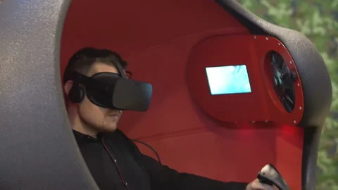 Man in Oculus 3d glasses playing video game Stock Footage 88680317