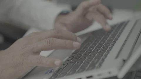 Man in offce typing on laptop 動画素材 330239738