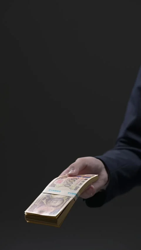Man offering a bundle of new banknotes Stock Footage 336766037