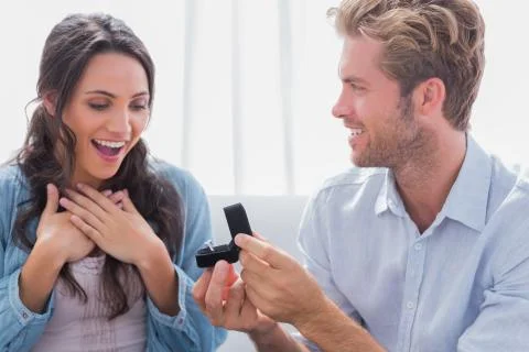 Man offering an engagement ring to his partner Stock Photos