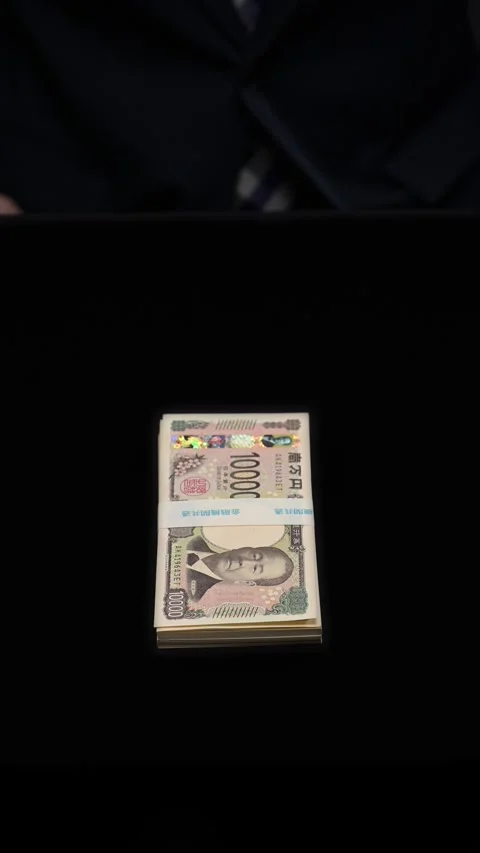 Man offering a wad of yen bills as a bribe Stock Footage 336766017