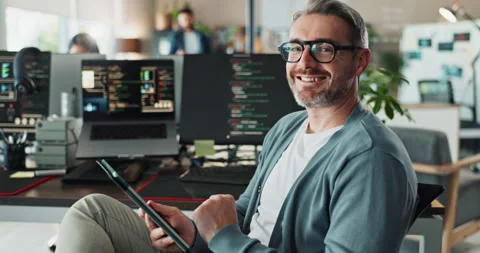 Man, office and happy with tablet for coding on research for upgrade or Stock Footage 290055523