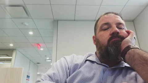 Man in Office Bored at Work Stock Footage 337521224