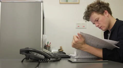 Man in office checking his appointments Stock Footage 41384440
