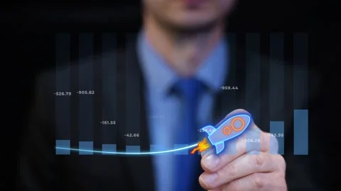 A man in office drawing rising graph with rocket animation. New Tech company Stock Footage 330952024