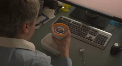 Man in office lunch near computer keyboard folk work Video stock 48999414