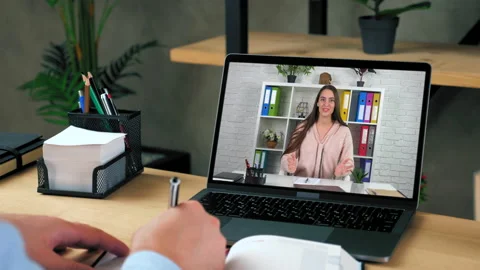 Man at office study online video call laptop listen teacher, writes in notebook Stock Footage 160389562