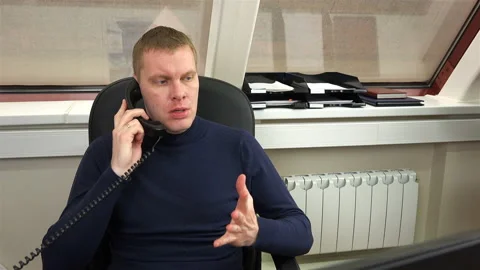 Man in the office talking on the phone Stock Footage 100116093