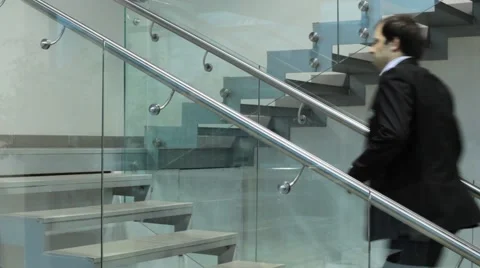 Man in the office walking up stairs Stock Footage 49920561