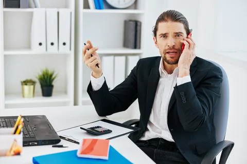 Man office work documents with a phone in hand technology Stock Photos