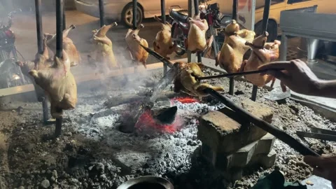 A man is oiling the chicken for a barbecue. Stock Footage 314119379