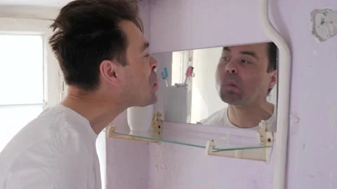 Man in old bathroom Stock Footage 194741485