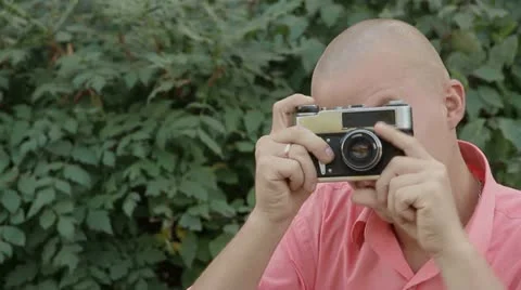 Man with an old camera Stock Footage 21669833