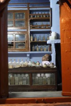 Man in old chemist shop. Stock Photos