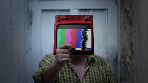 A Man with Old-fashioned TV set instead of Head and Color Bars in Background.  Stock Footage 162905530