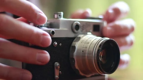 Man with an old russian photo camera in his hands 스톡 동영상 64622829
