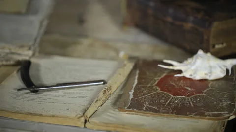 Man at old table, around old books and ritual things Video stock 143110311
