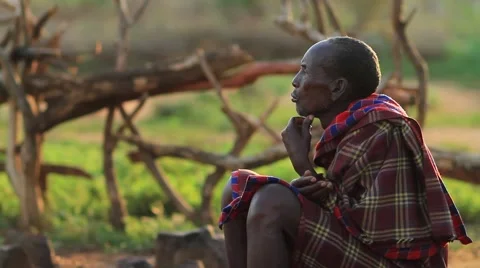 Man from the Omo Valley Sitting Deep in Thought Stock Footage 65240244