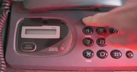 Man with one hand, dials 911 emergency number on an old push-button phone and Vídeos de archivo 236450781