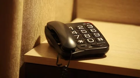 Man With One Hand, Dials 911 Emergency Number On An Old Push-Button Phone Stock Footage 297317112